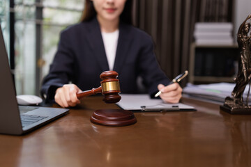 Lawyer Businesswoman Working with Documents and Signing Contract at Office Desk, Hammer on Wood table, Judge's Gavel, Law, Justice Symbol,