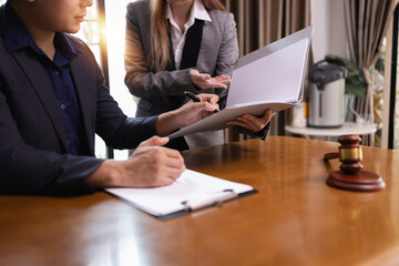 Two Lawyer with Document Paper and Hammer on Wood table,  Judge's Gavel, Law, Justice Symbol,...
