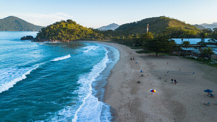 Drone photo of Praia Vermelha do Norte in Ubatuba, S&atilde;o Paulo, Brazil, with turquoise sea, clean sand and few people.