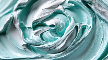 Abstract swirls of teal and white cosmetic cream texture