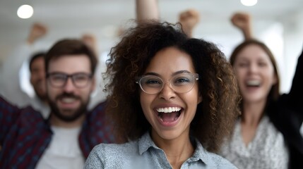 Diverse office team celebrates successful campaign with joy and excitement