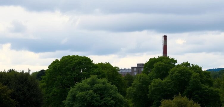 Overcast sky above lush green landscape, trees leading to old industrial building with tall chimney near Green Lane, Manningham, Bradford,  urban,  derelict