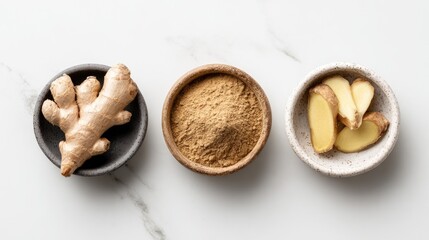 Fresh Ginger Root, Powder, and Slices in Bowls on Marble Background