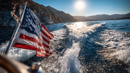 American flag waves proudly on a moving boat as water splashes bright against a sunny coastal backdrop