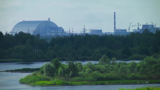 Chernobyl power plant view from Pripyat rive. Chernobyl new safe confinement arch. Ukraine