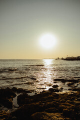 ocean shore at sunset with sun and summer evening atmosphere. Turkish culture and nature. Dream and travel to seaside vacation with waves and sea breeze