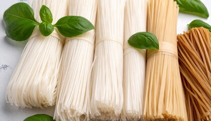 Assorted Dried Pasta Noodles and Fresh Basil.