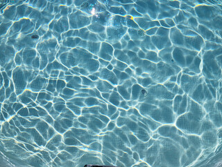 Blue water in the pool. Beautiful summer background for inscriptions
