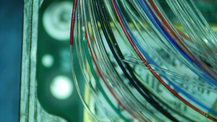 Futuristic abstract background of glowing complex fiber optic cable network. close up on colorful wire represents modern communication technology and high speed data transfer