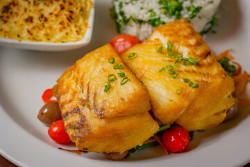Grilled sea bass served with creamy mashed potato casserole and broccoli rice