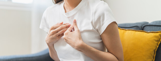 Close-up woman feel nausea touching her throat