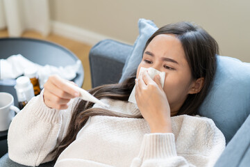 Women have a fever and a sore throat, and feel sick and cold.