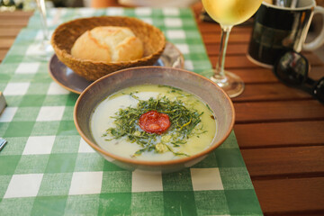 Caldo Verde Soup on a Wooden Table in Porto
