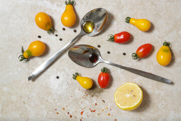 Summer salad ingredients - Freshly harvested cherry tomatoes, spoon of vinegar and olive oil, salt...