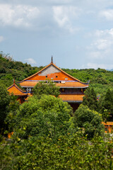 Fototapeta premium Ancient Architecture Nestled Among Lush Mountains