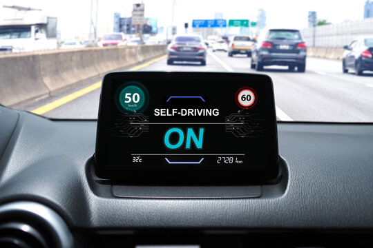 Self-driving car dashboard display with speed limit alert and active autonomous driving mode on highway