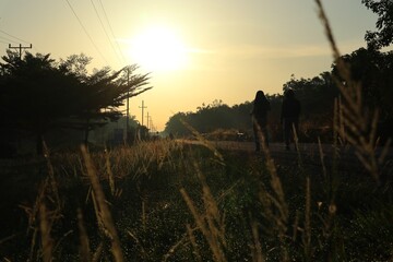 Golden hour walk in a serene landscape, embracing nature's beauty and tranquil atmosphere during