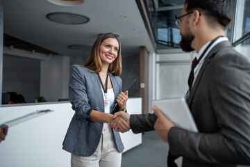 Business people shaking hands at conference meeting