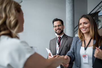 Business people shaking hands at conference meeting