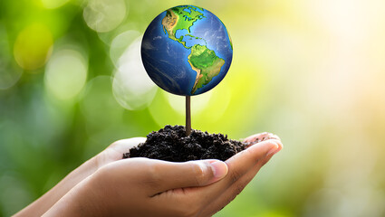 Global Conservation A Symbolic Representation of Environmental Responsibility with Hands Holding a Globe Emerging from Soil Against a Blurred Green Background