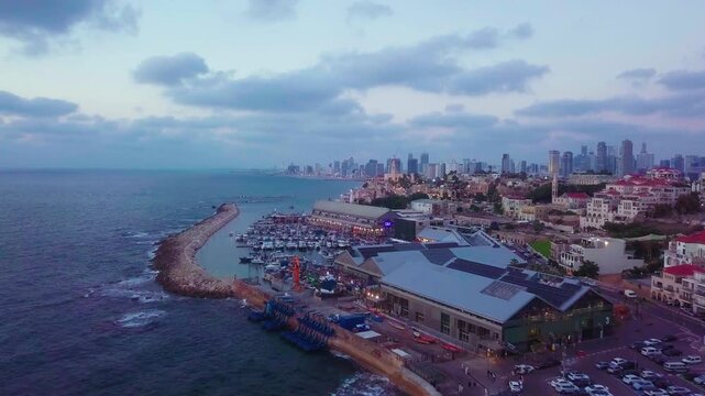 Aerial of Jaffa port after sunset fling towards Tel Aviv Israel