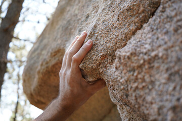 Hand on Sharp Granite Boulder in Sintra Forest for Sport Bouldering