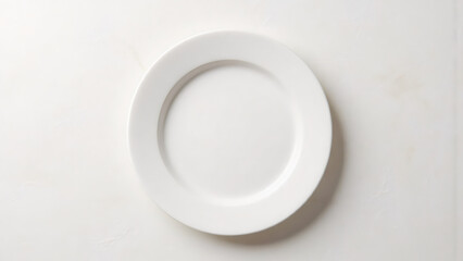 Empty White Plate on White Tabletop. Clean Porcelain Dinnerware Still Life Top View.