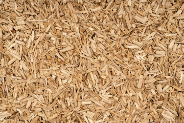 Wooden chips texture background close up. small wood chips for smoking top view. sawdust texture. ecological fuel