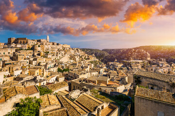 Naklejka premium Panoramic view of the ancient town of Matera (Sassi di Matera) in a beautiful autumn day, Basilicata, southern Italy. Stunning view of the village of Matera. Matera is a city on a rocky outcrop.
