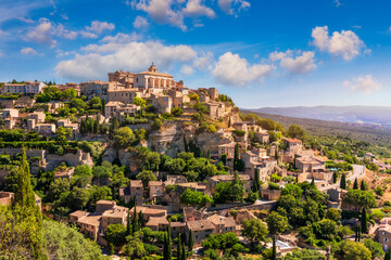 Fototapeta premium View on Gordes, a small typical town in Provence, France. Discover the stunning hilltop village of Gordes in Provence. Ancient hilltop village of Gordes, Provence, France.