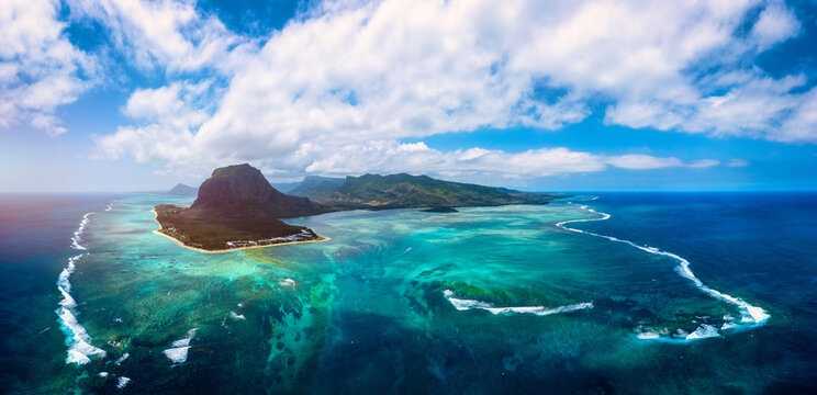 Aerial view of Mauritius island panorama and famous Le Morne Brabant mountain, beautiful blue lagoon and underwater waterfall. Le Morne Brabant peninsula and Underwater Waterfall, Mauritius.