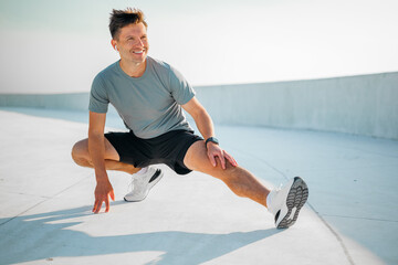 Flexibility and joy shine bright during an outdoor workout session at sunrise