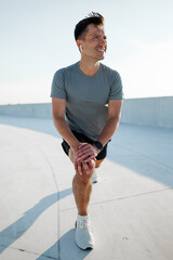 Stretching in the morning sun at an urban rooftop fitness space, invigorating the day ahead