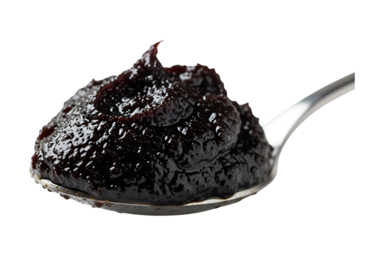 Delicious homemade plum jam on a spoon dark background perfect for breakfast time on transparent background