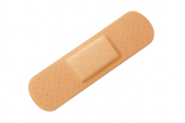 Beige medical adhesive bandage covering small wound, providing protective healing barrier on clean transparent surface