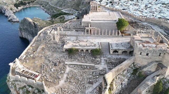 Aerial drone footage of Lindos Acropolis, in Greece.