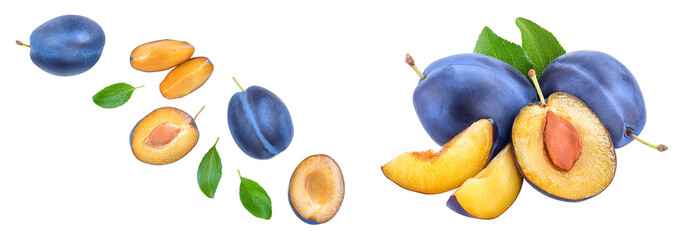 fresh blue plum and half with leaves isolated on white background. Top view. Flat lay