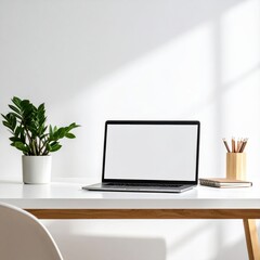 Fototapeta premium A laptop sits open on a white desk with a plant and pencils.