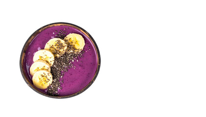 Purple smoothie bowl topped with banana slices and chia seeds for a healthy breakfast