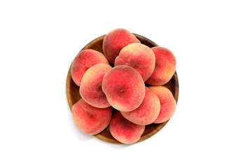 Pile of peaches on a white background bowl