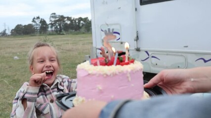 Celebrating the birthday of a little daughter in a mobile home