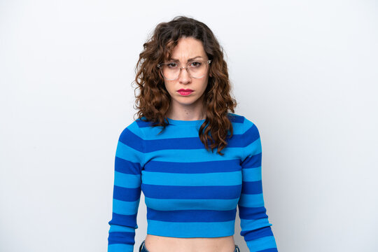 Young caucasian woman isolated on white background with sad expression