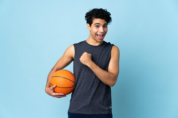 Venezuelan basketball player man over isolated background celebrating a victory