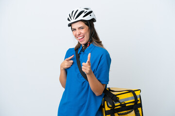 Young delivery woman with thermal backpack isolated on white background pointing to the front and smiling