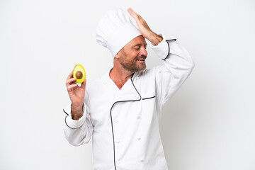 Chef man holding an avocado isolated on white background has realized something and intending the solution