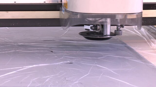 Flatbed cutter/router (cutting plotter).  Modern wide format printer paper for any purposes. Industrial printing modern digital inkjet printer 
