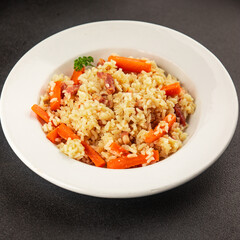 Rice meat and vegetables pilaf fresh delicious gourmet food background on the table rustic food top view copy space