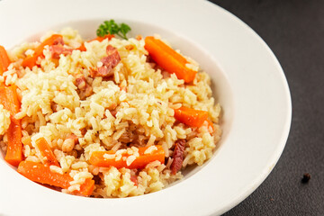 Rice meat and vegetables pilaf fresh delicious gourmet food background on the table rustic food top view copy space