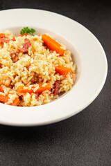 Rice meat and vegetables pilaf fresh delicious gourmet food background on the table rustic food top view copy space