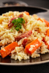 Rice meat and vegetables pilaf fresh delicious gourmet food background on the table rustic food top view copy space